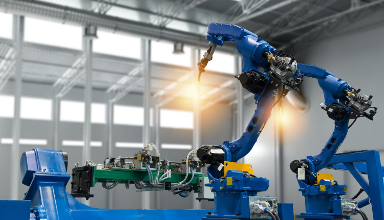 3DEO Honors Women’s Month 2019, Sponsors Women in 3D Printing Robotic arms welding car parts on a production line in an industrial setting.