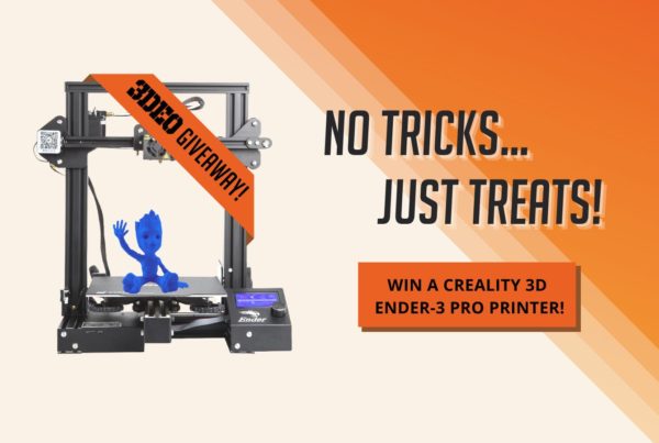 Image of a 3D printer with a giveaway banner. Text reads "NO TRICKS... JUST TREATS! WIN A CREALITY 3D ENDER-3 PRO PRINTER!" on an orange gradient background.