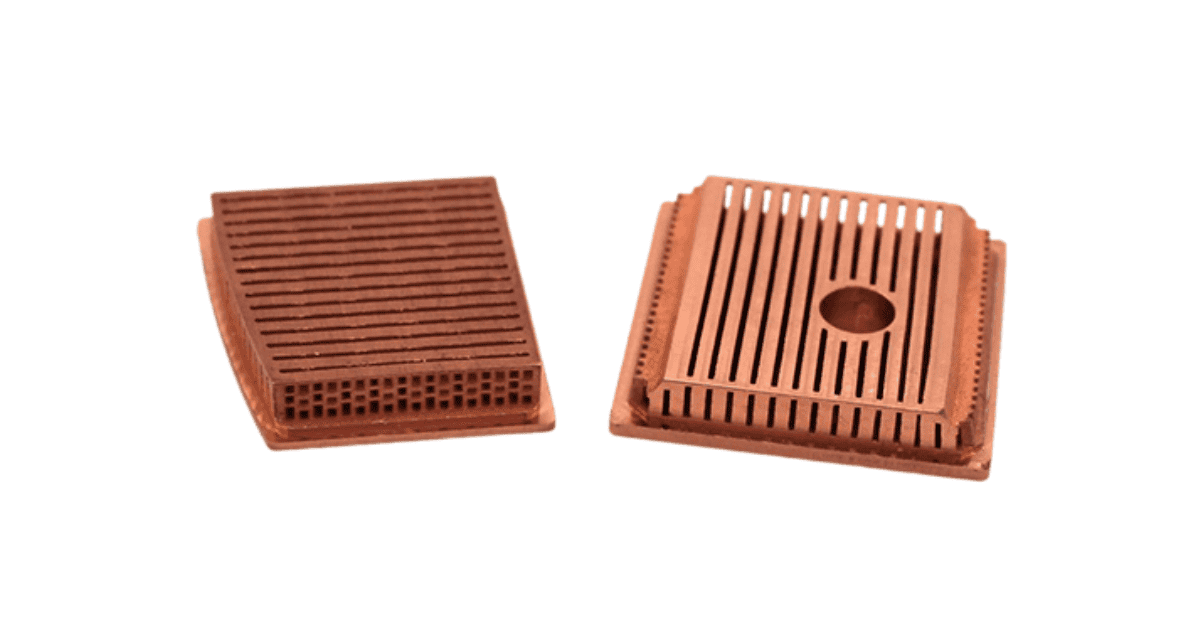 3DEO Wins Grand Prize in Electronic/Electrical Components Category at 2025 MPIF Design Excellence Awards Two copper heat sinks with grooved and slotted surfaces, placed side by side on a white background, showcasing design excellence.